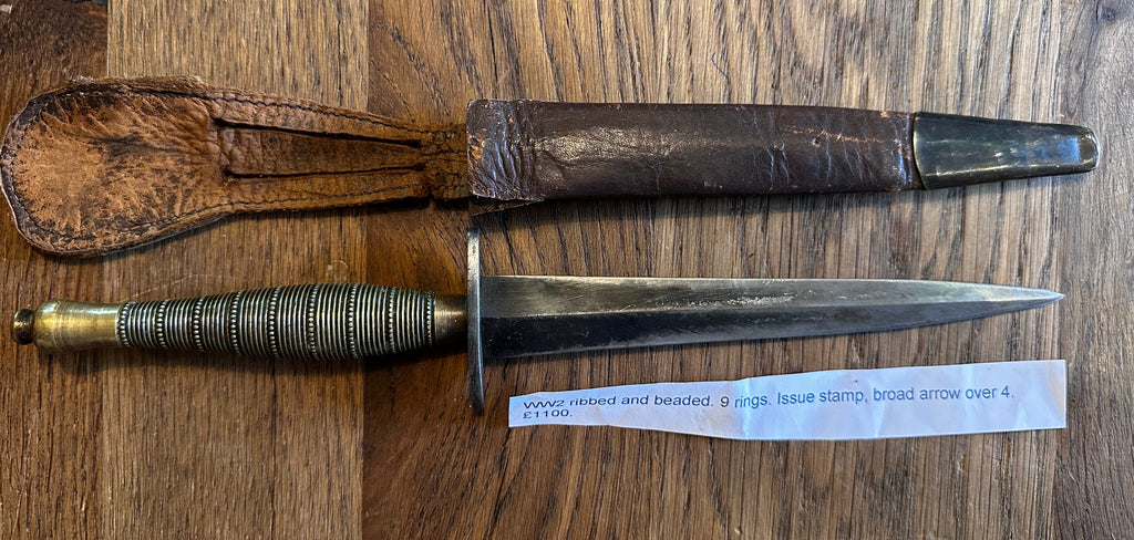 Fairburn Sykes Commando Dagger - WW2 Issue ribbed and beaded 9 rings, rare with issue stamp broad arrow over 4.